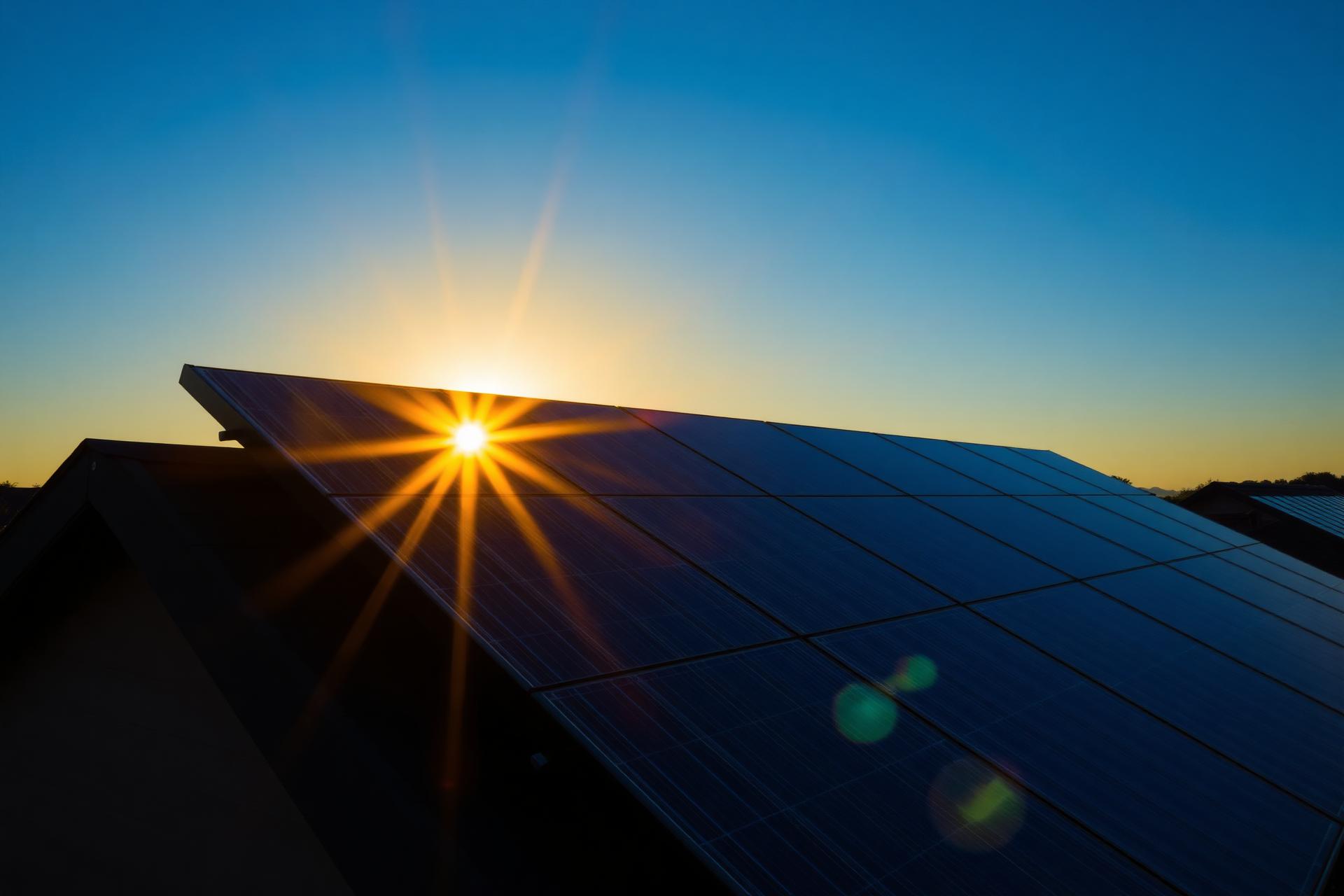Sunrise over residential solar panels